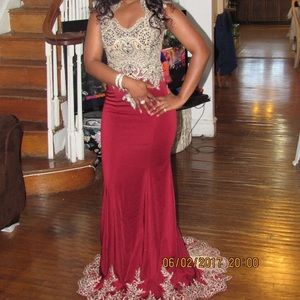 It’s a red/burgundy prom or formal dress or gown.